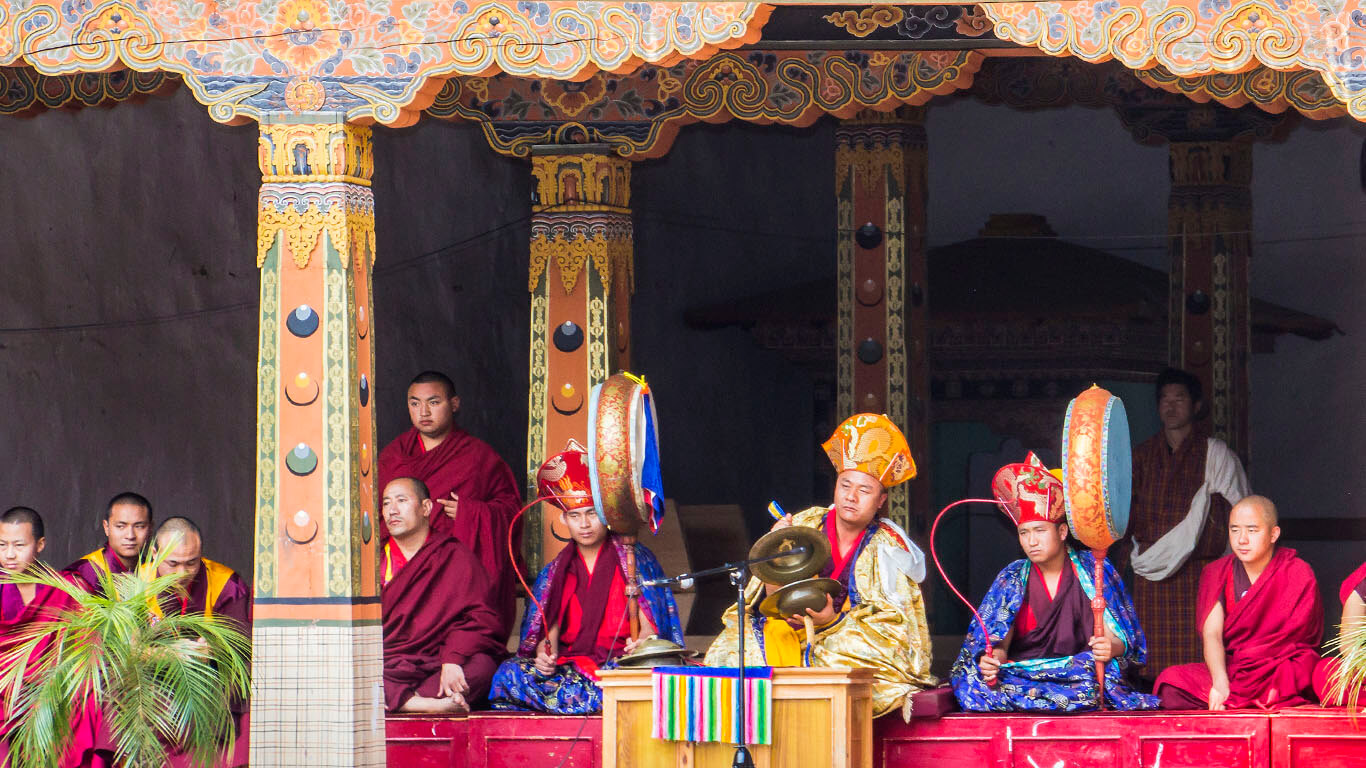 The band is playing for the dancers at drupchen festival in the dzong of Punakha, Bhutan.